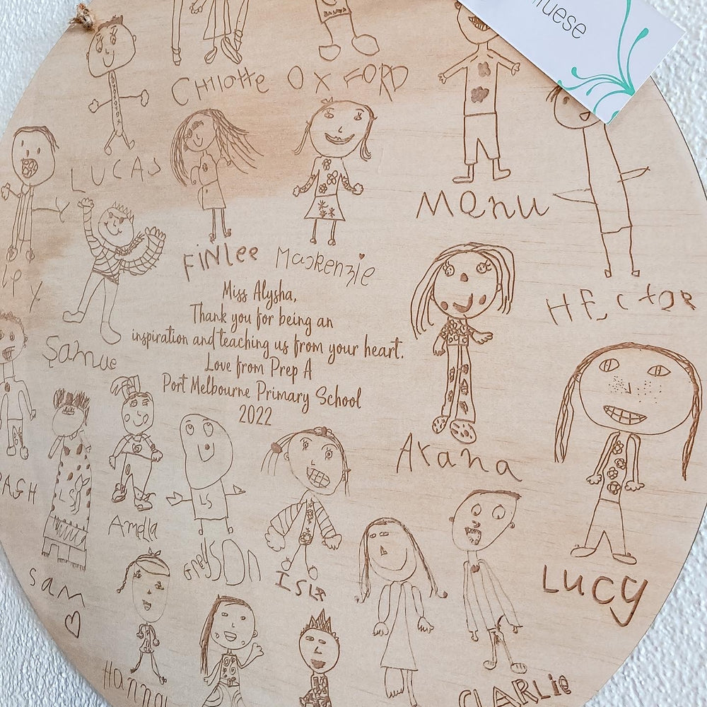 A unique gift for teachers full of drawings by their class engraved onto a timber plaque to display in the classroom
