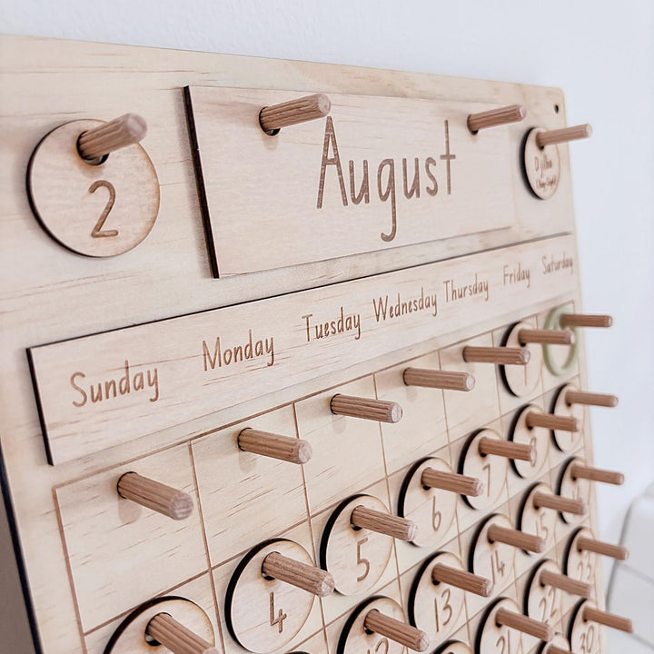 Montessori-inspired classroom calendar with wooden discs for days, months, seasons, weather incl. six Nyoongar seasons.