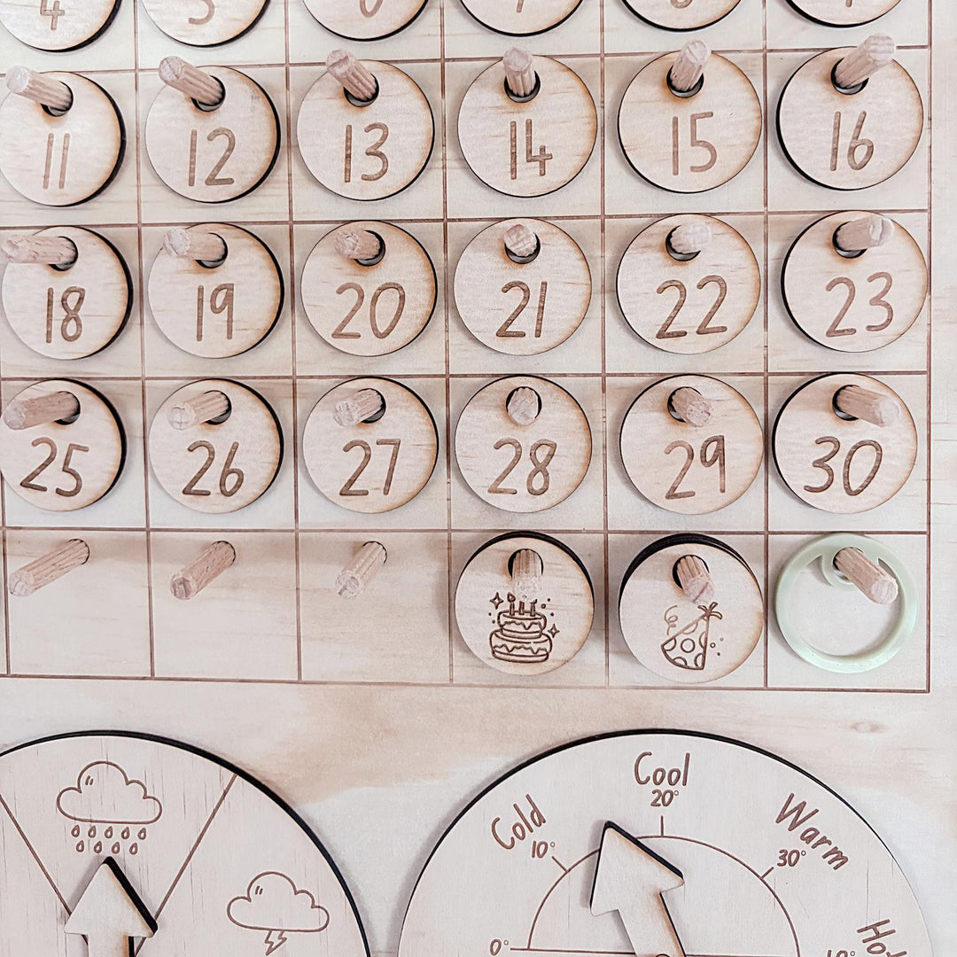 Montessori-inspired classroom calendar with wooden discs for days, months, seasons, weather incl. six Nyoongar seasons.
