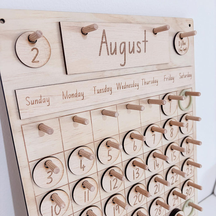 Montessori-inspired classroom calendar with wooden discs for days, months, seasons, weather incl. six Nyoongar seasons.