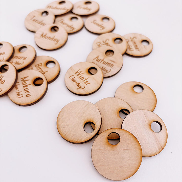 Montessori-inspired classroom calendar with wooden discs for days, months, seasons, weather incl. six Nyoongar seasons.